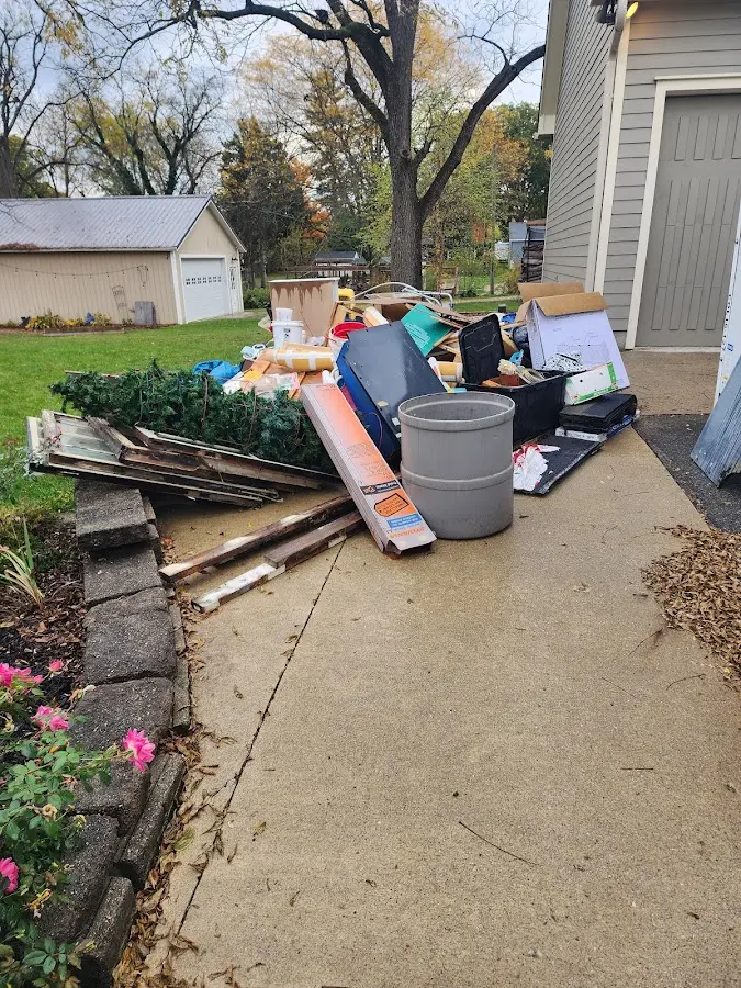 Dumpster being loaded with debris for Roofing Dumpster Rental in Barling